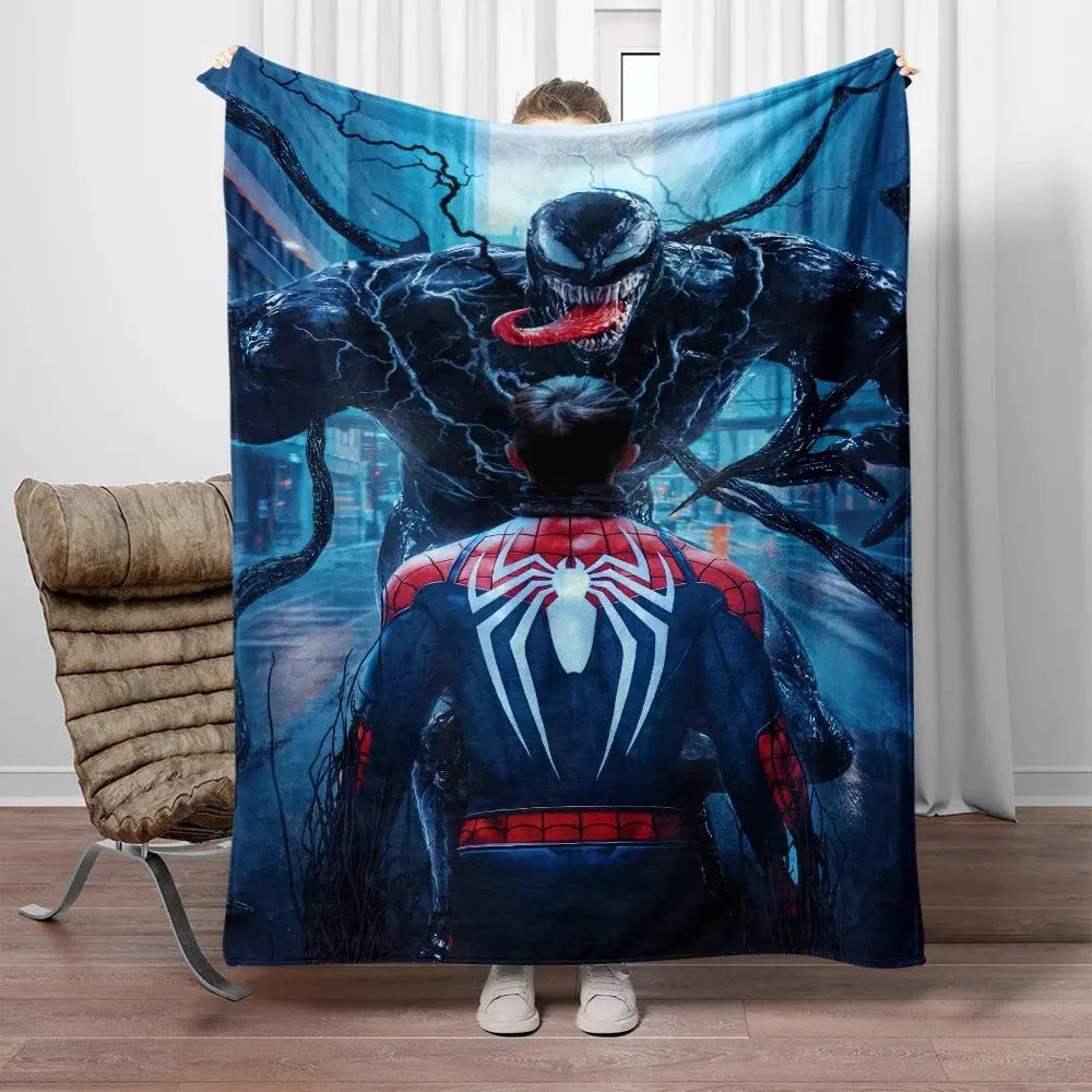 Dual-sided Spider-Man and Venom flannel blanket draped on sofa