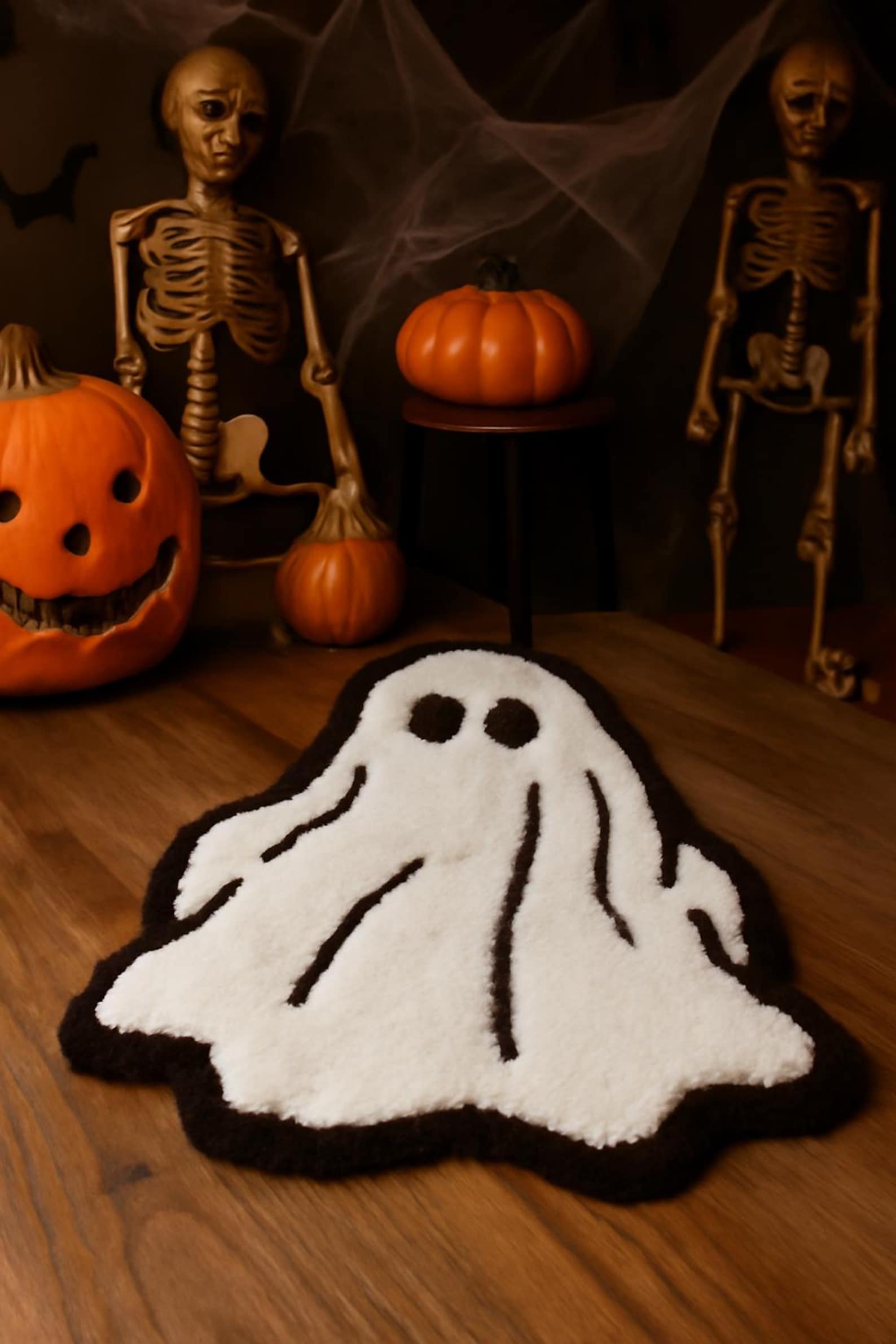 Spooky ghost-shaped rug in entryway for fall home decor