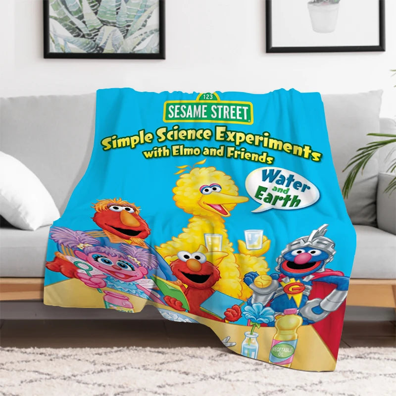 Vibrant colors and characters on Sesame Street kids blanket close-up