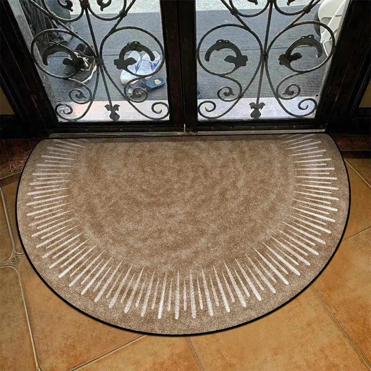 Vintage brown semi round rug placed at a kitchen or bathroom entrance