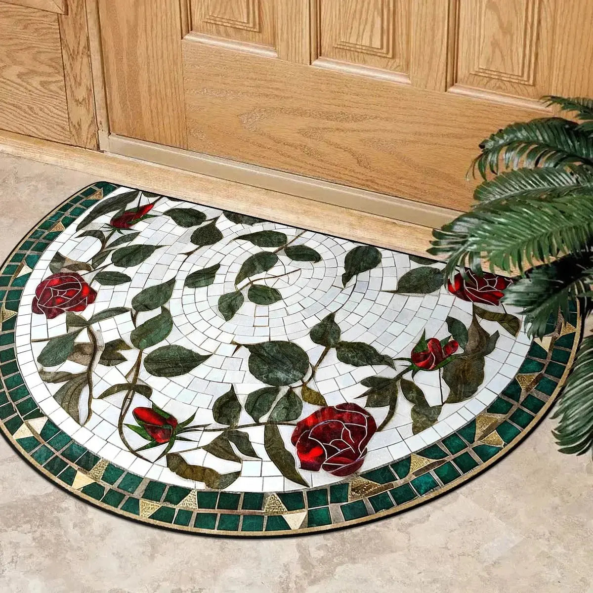 Half-round floral mosaic doormat with rose and leaf design placed at a vintage-style entrance